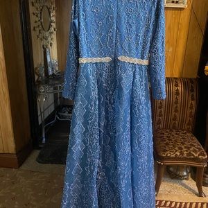 Beautiful blue color very sparkly sparkles very nice on the light A line fit